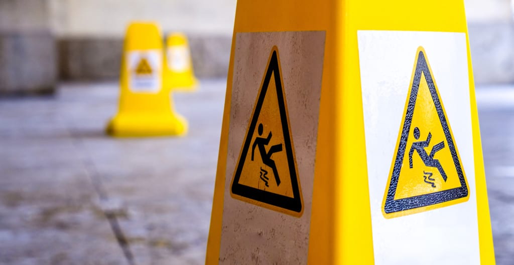 Caution wet floor sign at a sidewalk